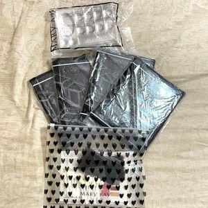 Mary Key sample trays, makeup mirror and testers